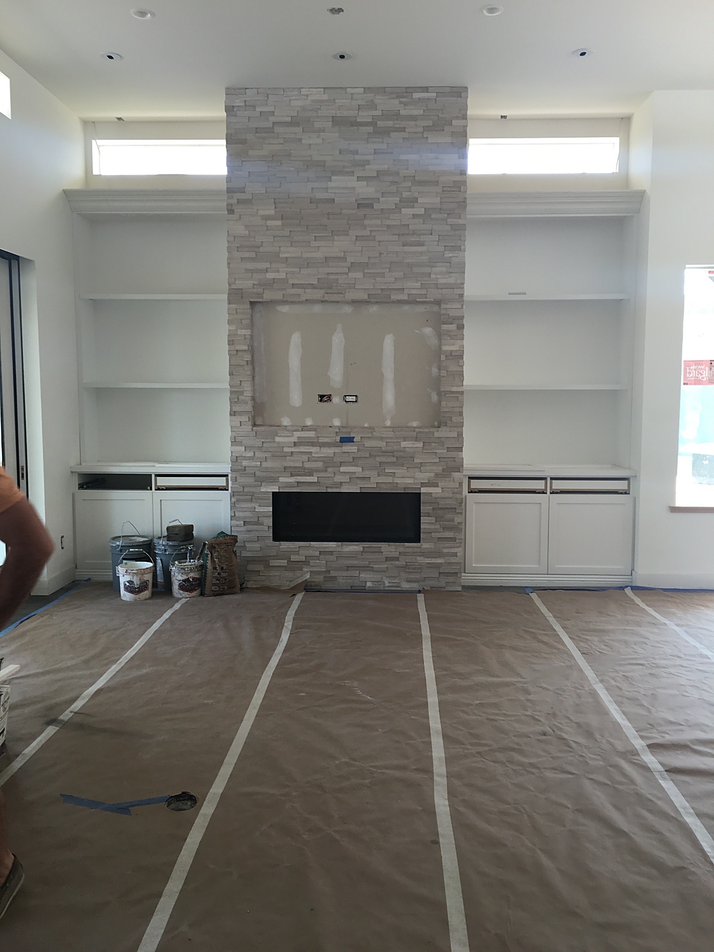 Fireplace wall and built-ins before