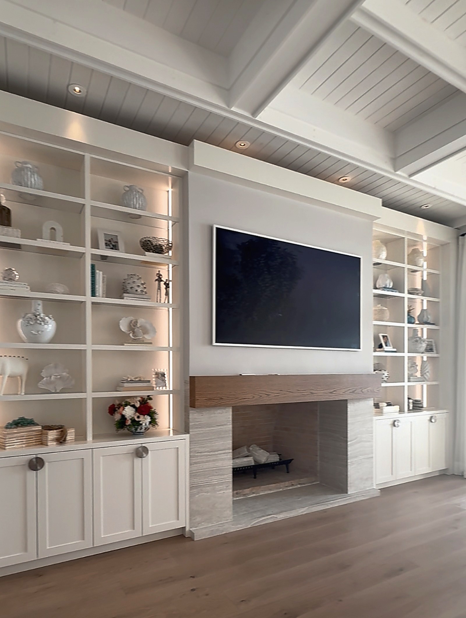 Hearth wall with lit built-ins after